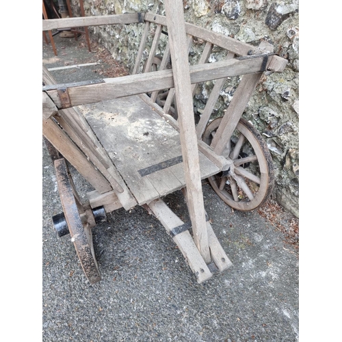 1637 - A small old wooden cart, 68cm wide; together with an old ox yoke.