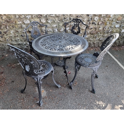 1639 - A black painted aluminium garden table, 80cm diameter; together with four chairs.... 