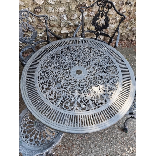 1639 - A black painted aluminium garden table, 80cm diameter; together with four chairs.... 