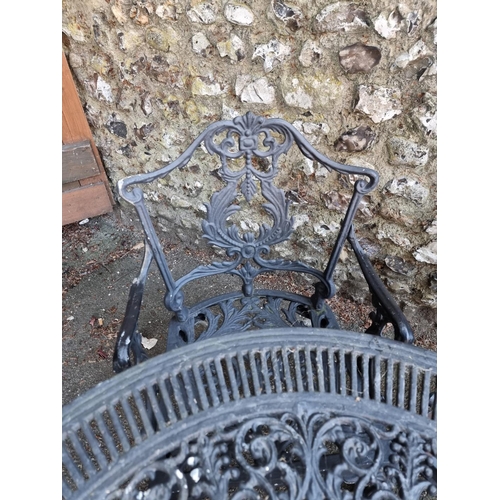 1639 - A black painted aluminium garden table, 80cm diameter; together with four chairs.... 