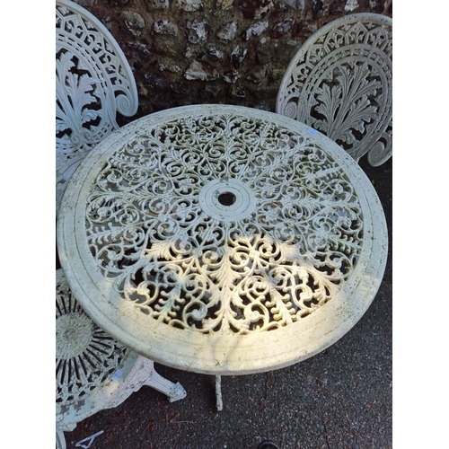 1640 - A white painted aluminium garden table, 69cm diameter; together with three chairs.