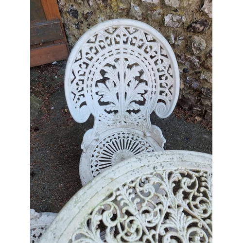 1640 - A white painted aluminium garden table, 69cm diameter; together with three chairs.