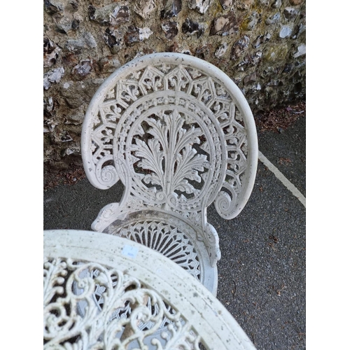 1640 - A white painted aluminium garden table, 69cm diameter; together with three chairs.