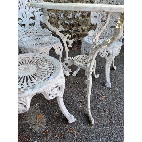 1640 - A white painted aluminium garden table, 69cm diameter; together with three chairs.