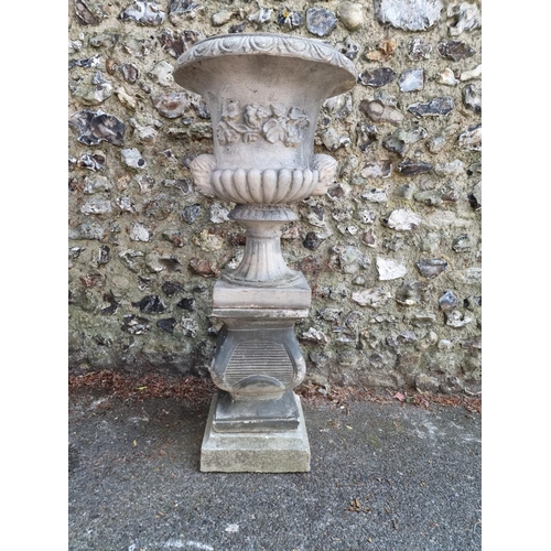 1649 - A composition stone Campana urn and pedestal, 113cm high.