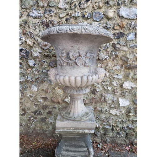 1649 - A composition stone Campana urn and pedestal, 113cm high.