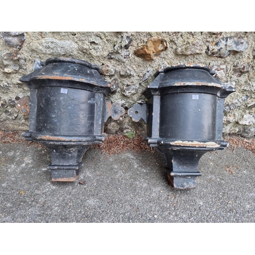 1651 - A large pair of black painted cast iron hoppers; together with a similar large water pump.... 