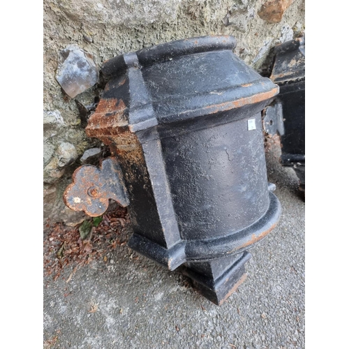 1651 - A large pair of black painted cast iron hoppers; together with a similar large water pump.... 