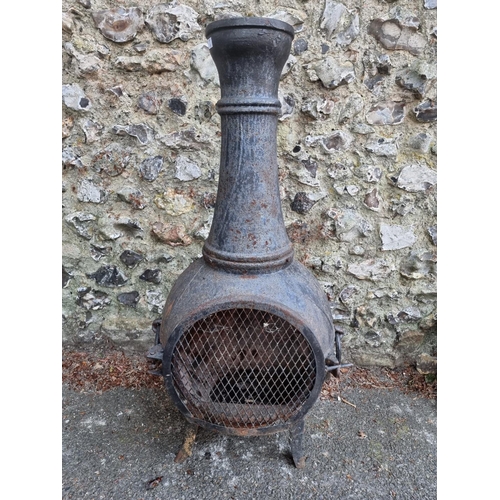 1652 - A black painted cast iron chimenea, 105cm high.