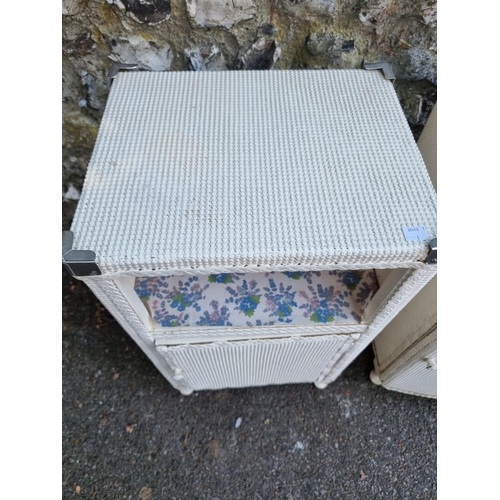 1658 - Two similar Lloyd Loom bedside cupboards.