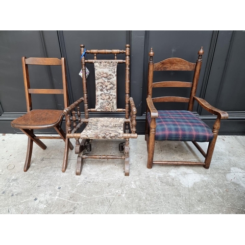 1673 - A child's rocking chair; together with a child's elbow chair and a folding child's chair.... 