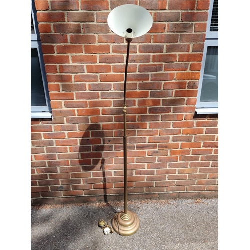 1024 - An old brass articulated standard lamp. 