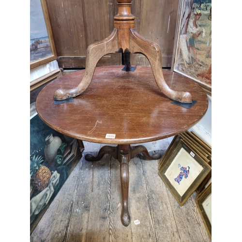 1030 - An 18th century mahogany circular tilt-top tripod table, with birdcage action and one piece top, 84c... 