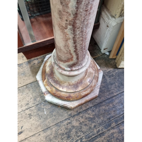 1032 - A marble pedestal, with square top and octagonal base, 105cm high.  