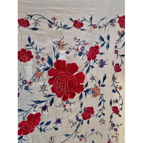 1315 - A Chinese embroidered silk shawl, finely decorated with flowers, size excluding tassels approx 135cm... 