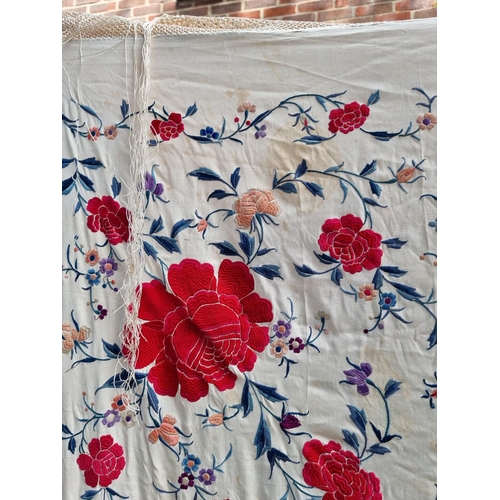 1315 - A Chinese embroidered silk shawl, finely decorated with flowers, size excluding tassels approx 135cm... 