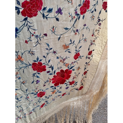 1315 - A Chinese embroidered silk shawl, finely decorated with flowers, size excluding tassels approx 135cm... 