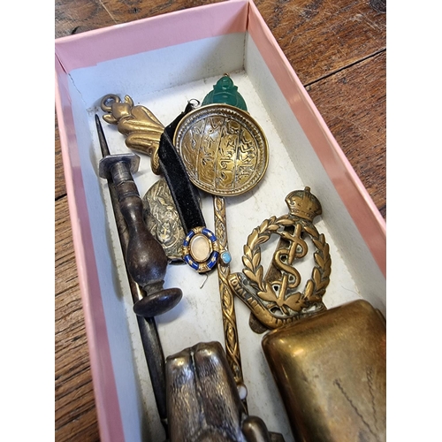 1528 - A mixed lot of works of art, to include a 9ct gold mounted jade Buddha pendant, 15mm high; a brass p... 