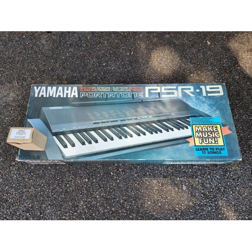 1641 - A Yamaha Portatone PSR-19 electric keyboard, boxed.