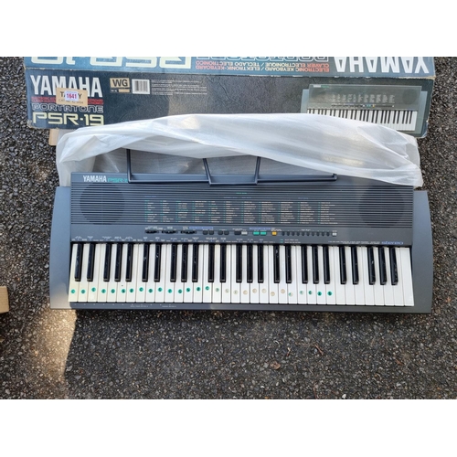 1641 - A Yamaha Portatone PSR-19 electric keyboard, boxed.