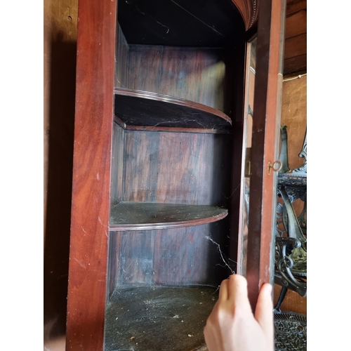 1648 - An antique mahogany hanging bowfront corner cupboard, 95cm high.