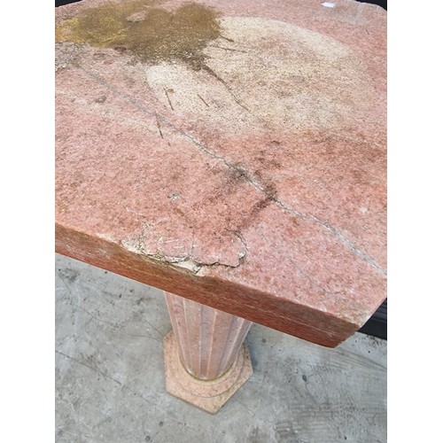 1031 - A pink marble pedestal, with hexagonal top & base and fluted column, 101.5cm high.... 