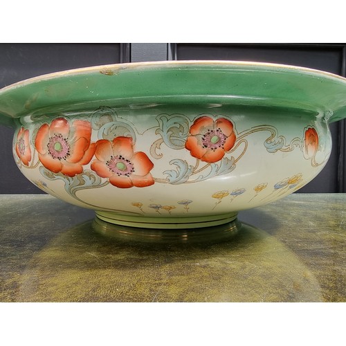 1310A - A large Art Nouveau pottery 'Poppy' pattern basin, 42.5cm diameter.