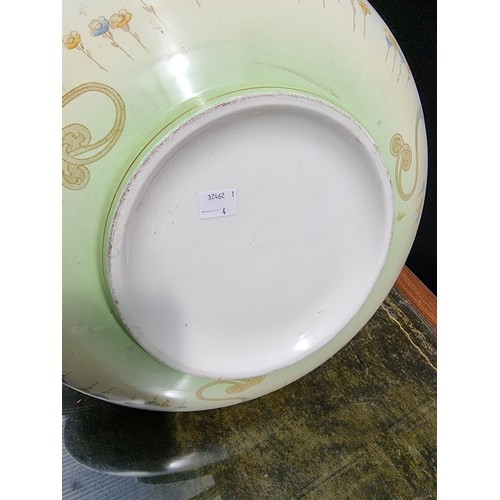 1310A - A large Art Nouveau pottery 'Poppy' pattern basin, 42.5cm diameter.