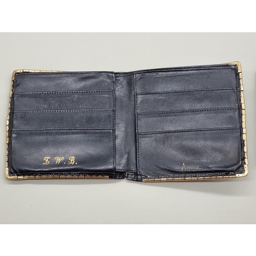 1511 - A 9ct gold mounted snakeskin wallet, by Asprey; together with another Harrods black leather exa... 