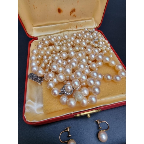 219 - Three pearl necklaces; together with a pair of 9ct gold pearl screw back earrings; and a gold plated... 