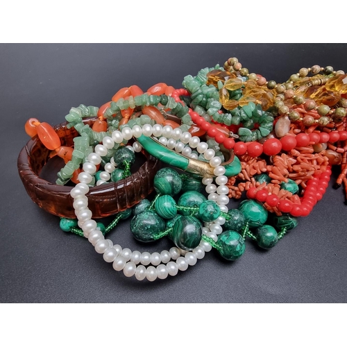 228 - A coral necklace; together with various natural stone necklaces and costume jewellery.... 