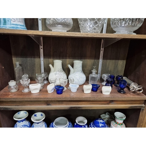 1449 - A collection of antique glass eyebaths and other medical items, to include Bristol Blue examples.... 