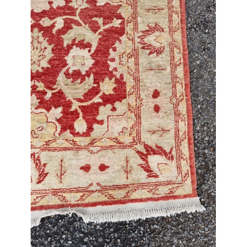 1006 - A Persian rug, having allover floral decoration on a cream ground, 156 x 100cm.