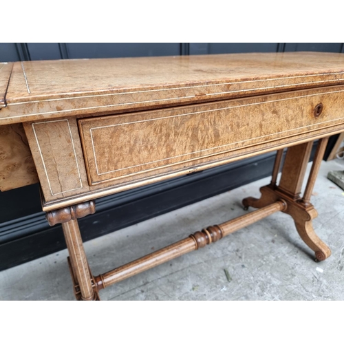 1095 - A fine Charles X amboyna & ivory line inlaid sofa table, 155cm when open.En suite with the previ... 