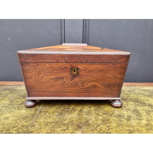 1124 - A Regency rosewood sarcophagus tea caddy, 31.5cm wide. 