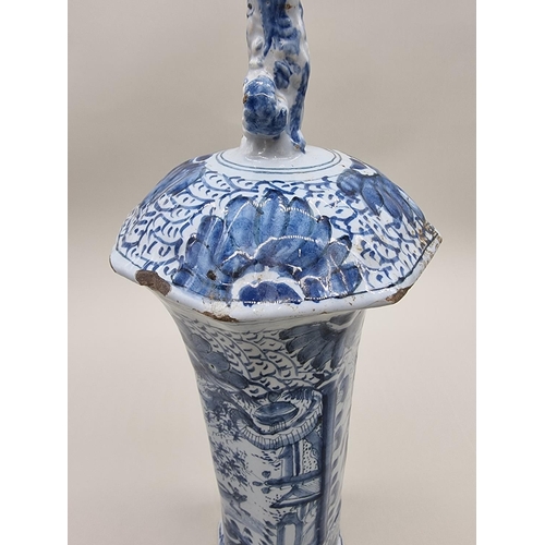 1359 - A tin glazed pottery delftware vase and cover, 18th/19th century, painted with a Chinese figure, 35.... 