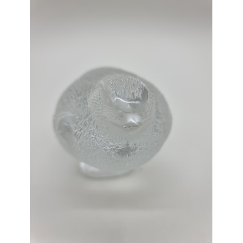 1365 - A Lalique 'Perdrix Couchee' frosted glass figure, 15.5cm long, (chip to beak).... 