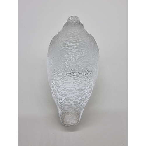 1365 - A Lalique 'Perdrix Couchee' frosted glass figure, 15.5cm long, (chip to beak).... 