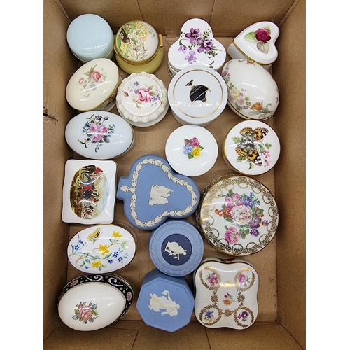 1378 - A collection of small porcelain boxes and covers.