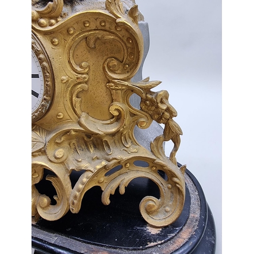 1386 - A late 19th century gilt spelter mantel clock, 43.5cm high, with pendulum, on ebonized stand.&n... 