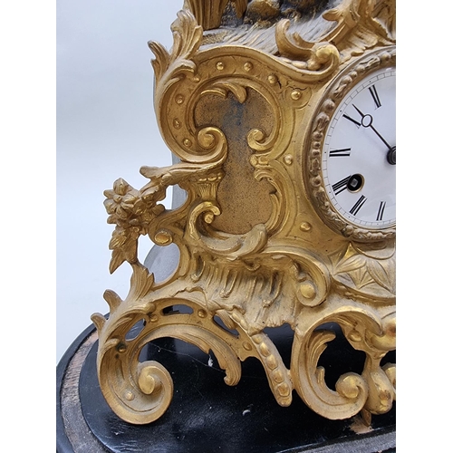 1386 - A late 19th century gilt spelter mantel clock, 43.5cm high, with pendulum, on ebonized stand.&n... 