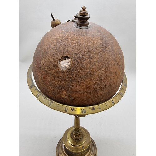 1389 - A scarce early 20th century globe timepiece, inscribed 'The Empire Clock', 39cm high, (faults).... 