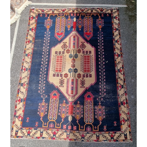 1005 - A Persian rug, with central geometric medallion and geometric borders, 236 x 177cm.