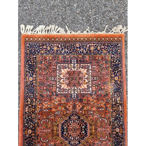 1008 - A modern Persian runner, having geometric design, 328 x 70; together with a similar rug, 174 x 80cm.... 