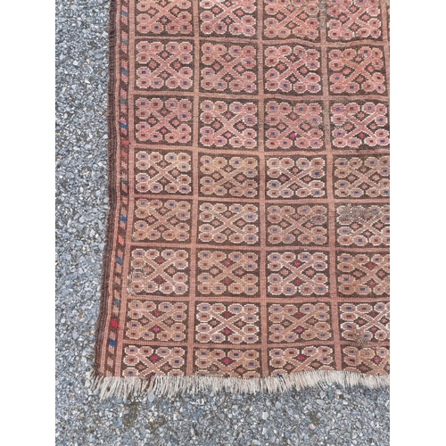 1011 - A small Bokhara rug, having repeated decoration, 150 x 94cm.