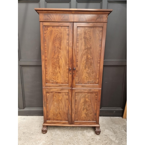 1014 - A 19th century mahogany double wardrobe, 111.5cm wide, converted.