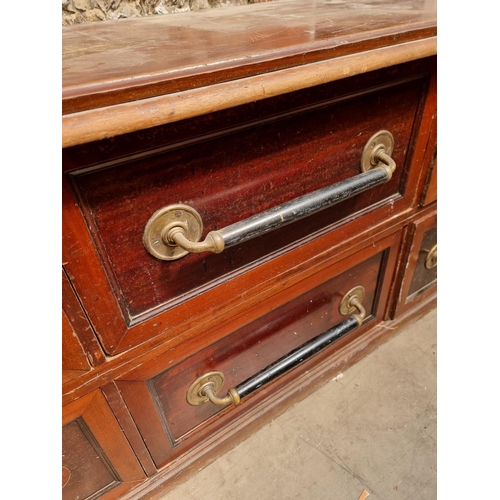 1015 - A large antique mahogany shop counter, with six drawers, 234cm wide, (a.f.).