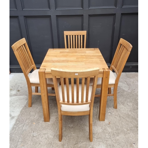 1032 - A contemporary pale oak dining table and four chairs, the table 80cm wide. ... 
