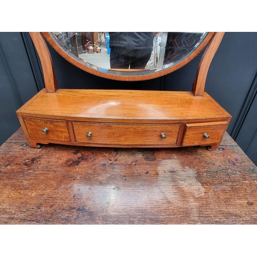 1049 - A good and large Victorian satinwood and chequerbanded toilet mirror, 66.5cm wide.... 