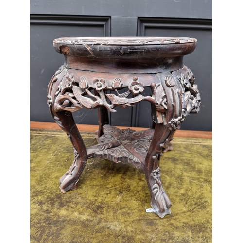 1060 - A Chinese carved hardwood and marble top jardiniere stand, 37cm high. 